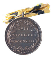 TMNK 05280
<br/>
Haagse vrijwilligers die bij de staatsomwenteling naar Woerden trokken, draagteken
<br/>
<em>Nederland, soeverein vorstendom (1813-1815)</em>